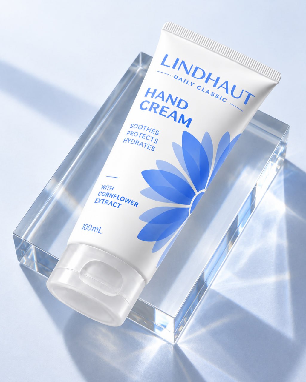 LINDHAUT Daily Classic tube resting on a clear glass block in sunlight